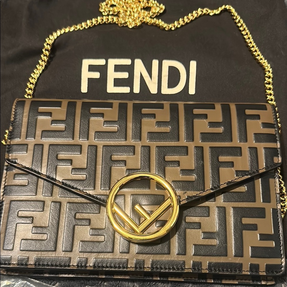 Fendi zucca Brown and Black print crossbody/Clutch with Gold Accent.